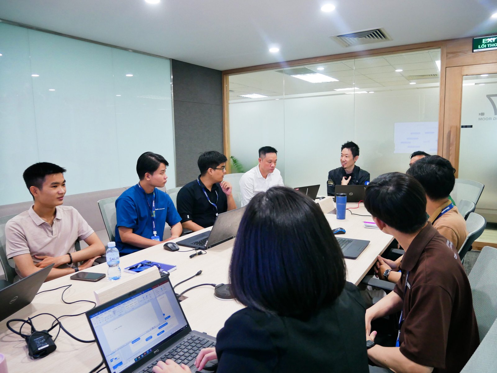 People looking at laptop